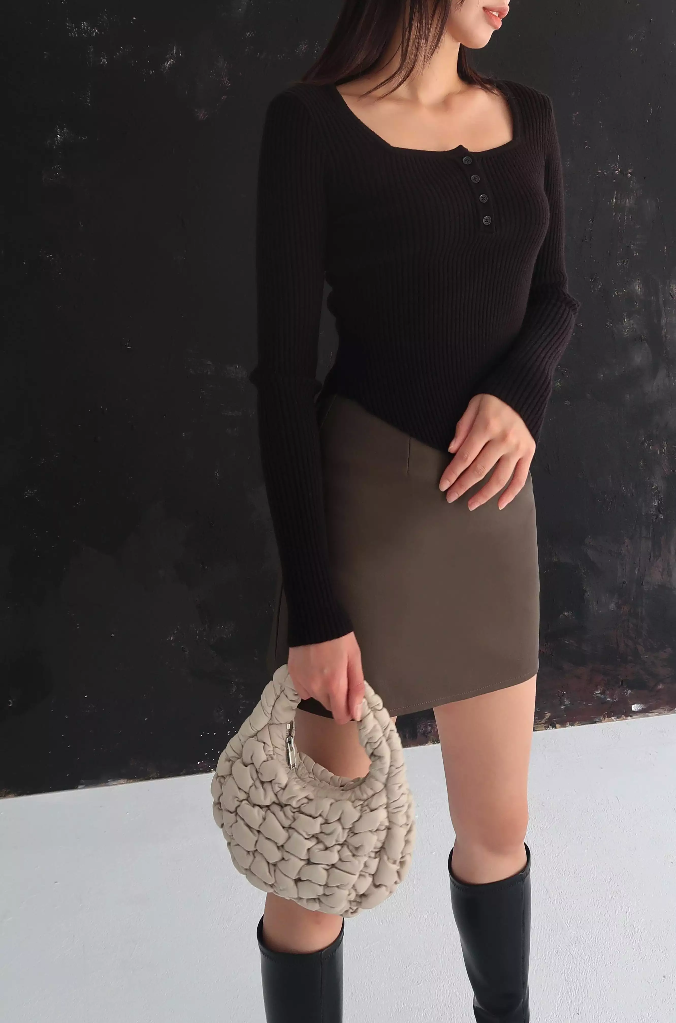 Brown faux leather skirt with confident style.